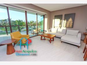 Depa en renta vacacional con terraza y vista a jardines y albercas