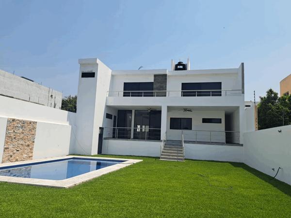 HERMOSA CASA NUEVA MINIMALISTA CON ALBERCA, JARDIN, 5 RECAMARAS 7 BAÑOS. VIGILANCIA.